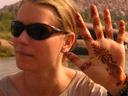 Ashe showing off her henna designs. A local girl had painted the designs the night before in her familys living room.